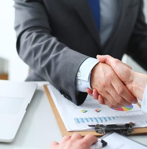 Business people shaking hands, finishing up a meeting Business handshake. Business people shaking hands, finishing up a meeting
